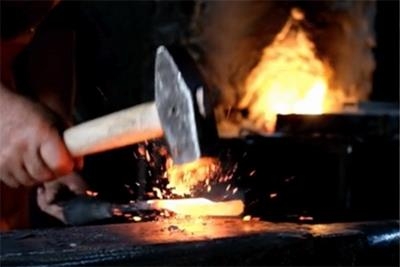 hammer in front of fire