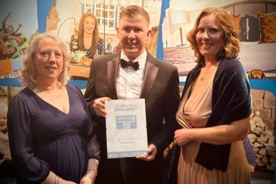 three castle staff with certificate