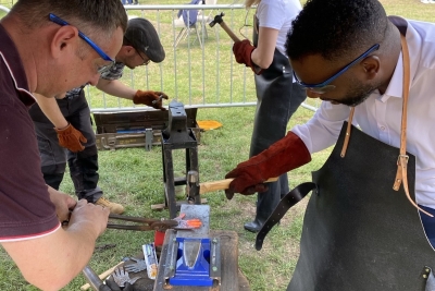 Two people creating a sculpture