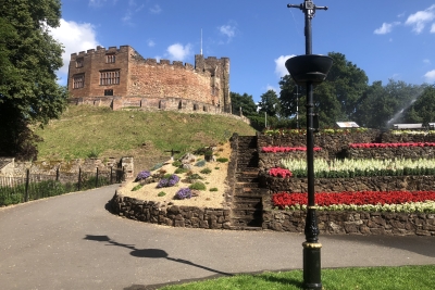 Tamworth Castle behind summer flower beds